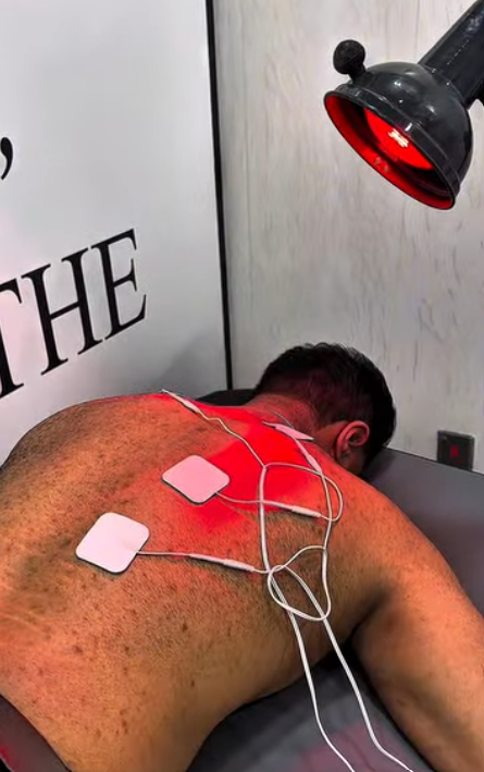 Electrotherapy and heat therapy treatment session at LiveFit